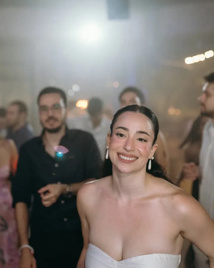 The bride smiling on the dance floor